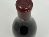a bottle of wine that is sitting on a table
