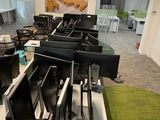 many computers on the desks in this office