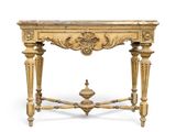 an antique console table with a marble top and ornate carvings