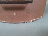 a close up of a piece of leather on a table