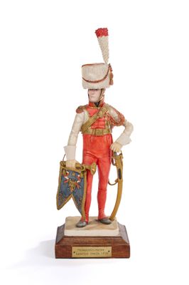 figurine of a toy soldier with a sword and shield