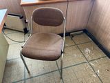 a chair that is sitting in front of a window