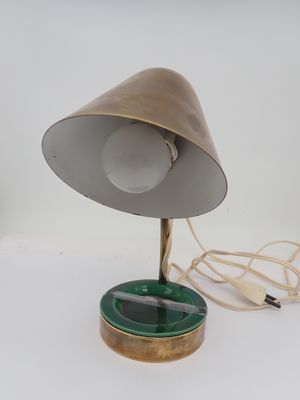 a lamp that is on a table with a cord