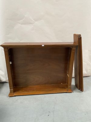 two pieces of wood are sitting next to each other on the floor