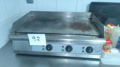 an image of a stove top with a lot of condiments on it