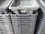 several plastic containers stacked on top of each other on a pallet
