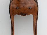 an image of a wooden chest of drawers with marble top