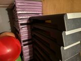 a stack of pizzas sitting on a shelf next to a red balloon