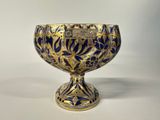 an image of a blue and gold vase with a gold and blue design