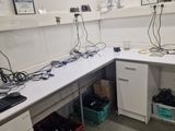 an image of a lab with a lot of wires on the counter