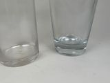 two glasses sitting next to each other on a table