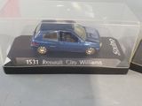 a small blue car in a clear box on a table