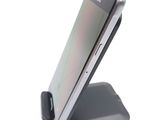 a cell phone that is sitting on top of a stand