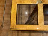 a glass table with a glass top on a wooden floor