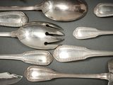 a lot of spoons and spoon spoons on a table