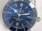 a close up of a wrist watch with a blue dial