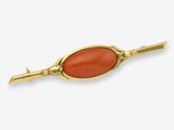 an image of a gold and carneline broochle