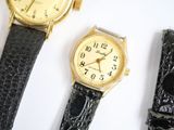 three different types of watches are displayed on a white surface