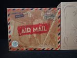 a box of air mail sitting on a table