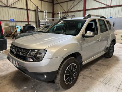 the silver dacia is parked in a garage with other cars