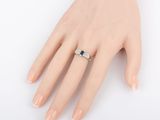 an image of a woman ' s hand with a ring on it