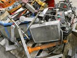 a pile of old televisions and other junk on a pallet