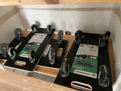 a lot of different types of skateboards sitting on a shelf
