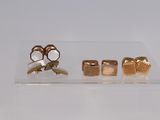 three pairs of gold cuff rings and a pair of gold cuff rings