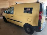 a yellow van that is parked in a garage
