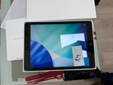 a tablet that is sitting in a box on a table