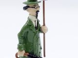 a figurine of a man in a green coat and hat holding an umbrella
