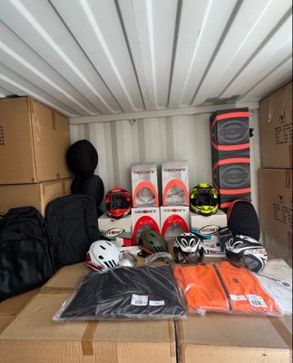 many boxes and helmets in the back of a moving truck