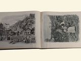 a book open to a drawing of a village