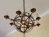 a chandelier hanging from the ceiling in a room