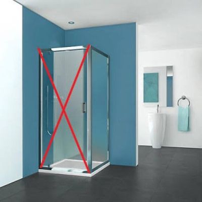 a picture of a bathroom with a blue wall and a glass shower