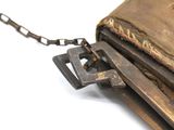 an old wallet with a chain attached to it