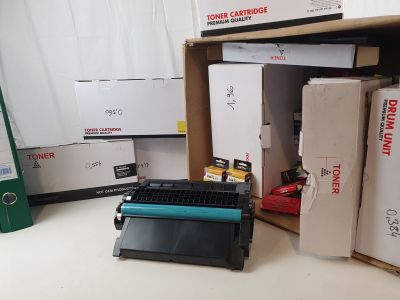 a pile of boxes and a printer sitting on a table