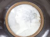 a plate with a picture of a woman on it
