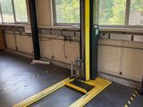 a fork lift in the middle of a large room