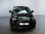 a small black car that is parked in a showroom