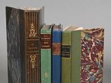 three books that are stacked on top of each other
