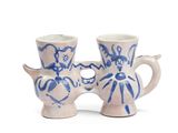 two cups that have been decorated with blue and white designs