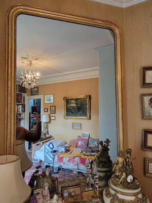 a large mirror in the middle of a living room