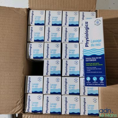 a box full of soap bars sitting on top of a cardboard box