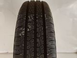 a close up of a tire on a wooden stand