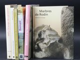 three books that are sitting next to each other on a table