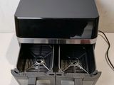a black stove with two burners on top of it