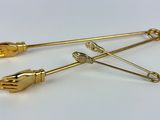 pair of gold plated hand and foot brooches