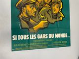 a poster on the wall of a building advertising a movie