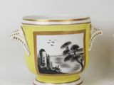 pair of yellow and white vases with a picture of a landscape on them